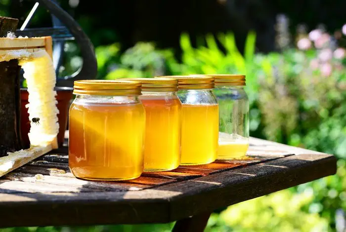 Image showing freshly harvested raw honey in jam jars - Health Benefits Of Honey